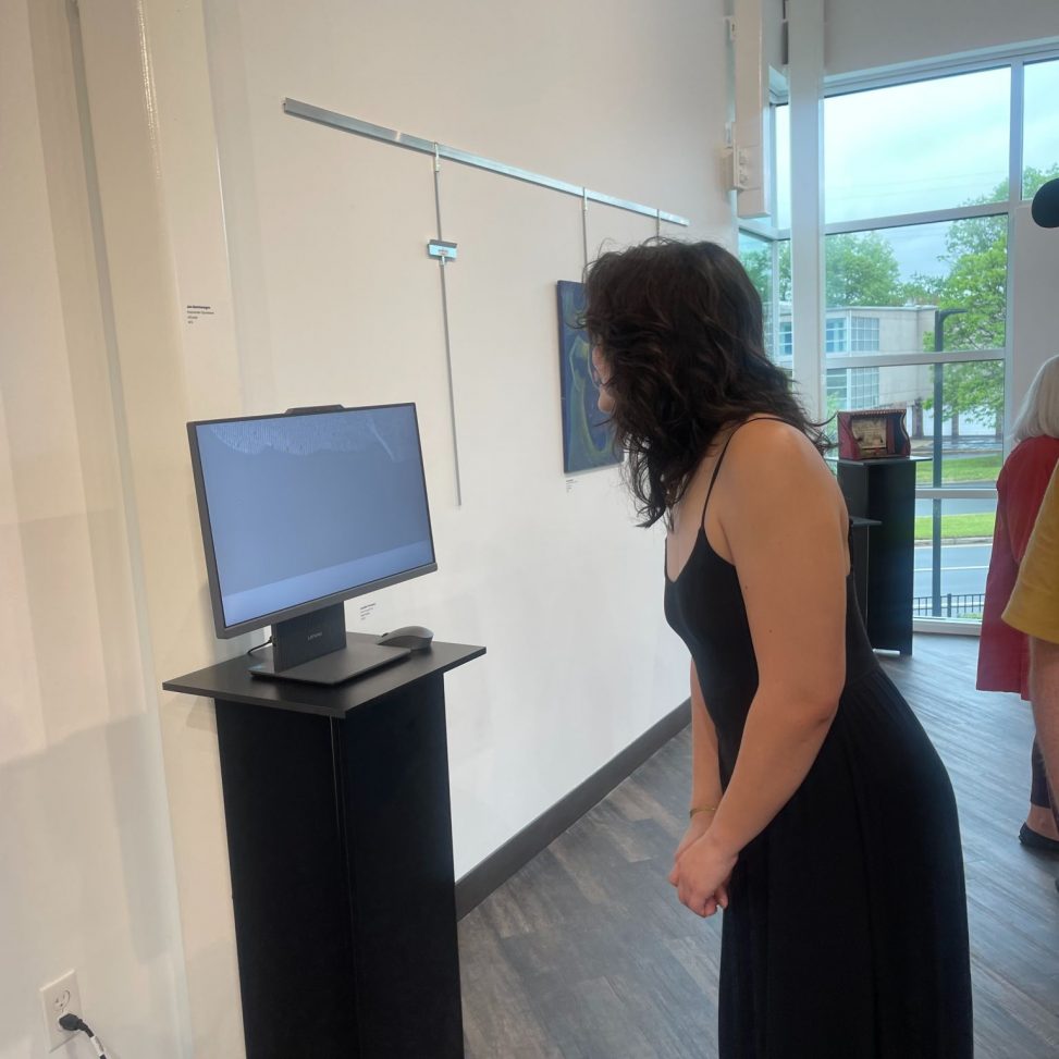 Jon Montenegro invites guest to view AI Emotion Detection Art
